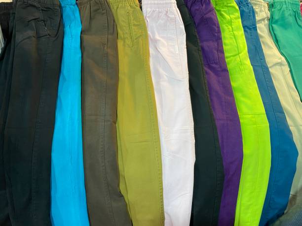 istock Stylish pants collection in retail store 1395182195