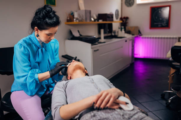 istock Millennium woman on permanent make-up treatment 1395183675