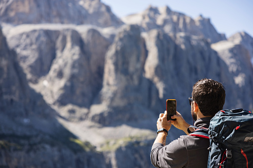 Hiking in the forest of the Dolomites, nearby Val Gardena, in the Puez Odle Natural Park