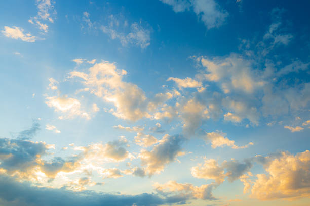 istock Clouds and yellow sky,The sun shining through low cloud,sunrise with clouds, light rays and other atmospheric effect 1395185256