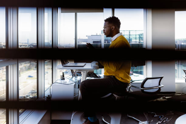 istock Black CEO working in his modern luxury office 1395185551