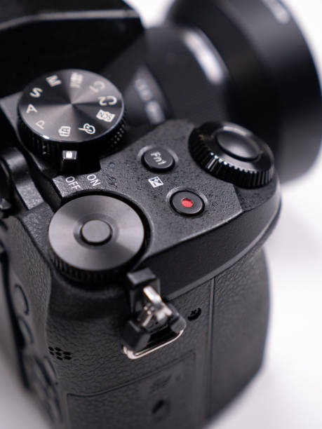 istock Control buttons and control rings on a mirrorless camera close-up view on a white background 1395185707