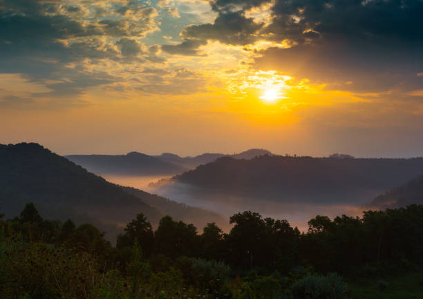 A misty summer sunrise over the Appalachians stock photo