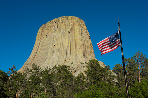 An American flag flying in the wind at Devils Tower National Monument