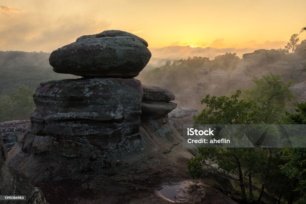 Sunset over rock formations, Garden of the Gods, Illinois A scenic summer sunset, after passing rain storm, over some of the interesting rock formations at Southern Illinois's Garden of the Gods in the Shawnee National Forest Shawnee National Forest Stock Photo
