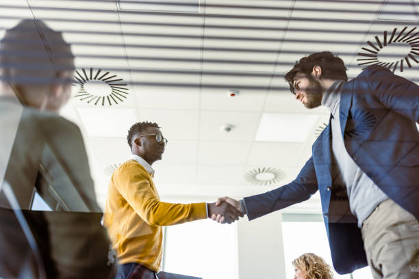 Businesspeople handshake after contract signing Making decisions with CEO and investors about future plans shareholders meeting stock pictures, royalty-free photos & images