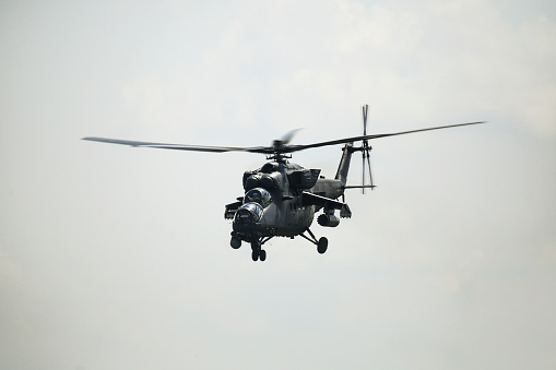 Russian military helicopter MI-24 during exercises in the Republic of Belarus. Flying in the sky.