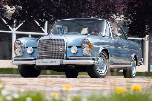 Bilbao, April 30, 2022: Mercedes 250 SE Automatic from the 60s in metallic blue, during an exhibition of classic cars in the streets of Bilbao.