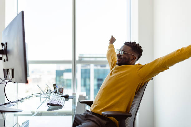Black CEO working in his modern office stock photo