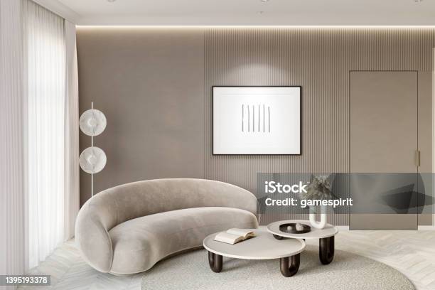 A Modern Living Room In Beige Tones With A Backlit Horizontal Poster Near The Door A Floor Lamp Next To The Window With White Curtains And Decor On A Coffee Table Next To A Modern Sofa Stock Photo - Download Image Now