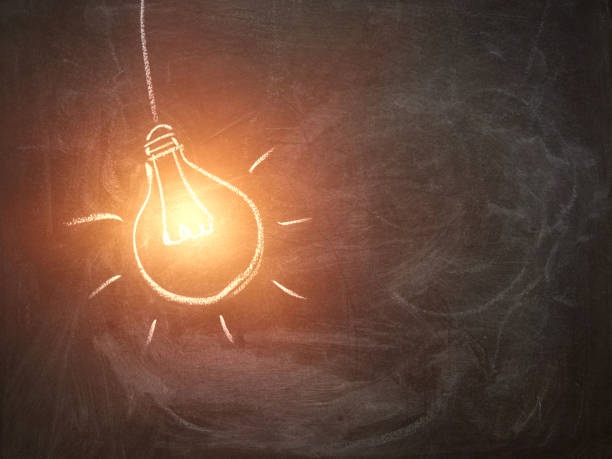 istock Light bulb chalked on a blackboard with space for text. inspiration concept. 1395193705