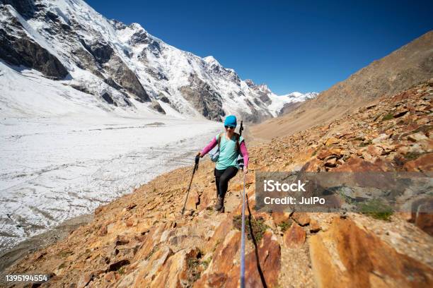 Young Woman Climbing With Rope In Mountains Stock Photo - Download Image Now - One Woman Only, Rope, Sport