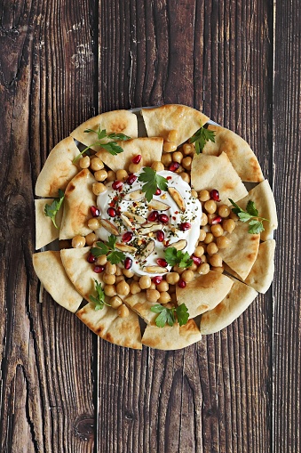 Chickpea Fatteh. Lebanese appetizer plate. Flat layot, selective focus