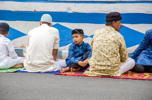 3rd may 2022 kolkata west bengal india :Picture taken during the preparation of Eid prayers in Kolkata. A child praying with his father is preparing for prayers.