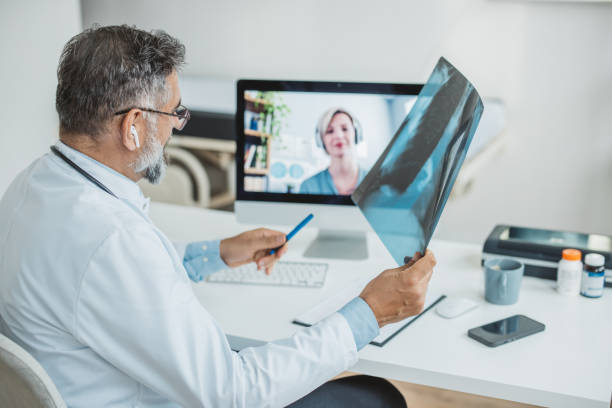 istock Doctor meeting remotely with his patient 1395197487