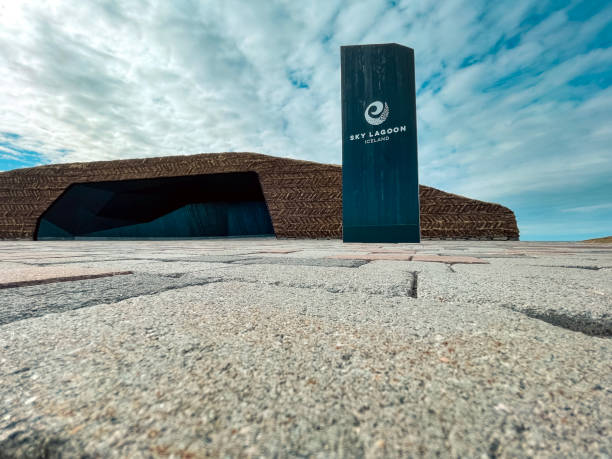 April 12, 2022, Kópavogur, Iceland,  Exterior Signage at the Sky Lagoon. Colorful brick pavers in the foreground, turf building in the background.