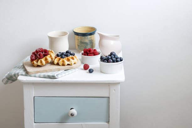 Served breakfast of waffles and summer berries, dessert with raspberries and blueberries.