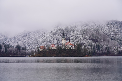 Church, lake, winter island, fog