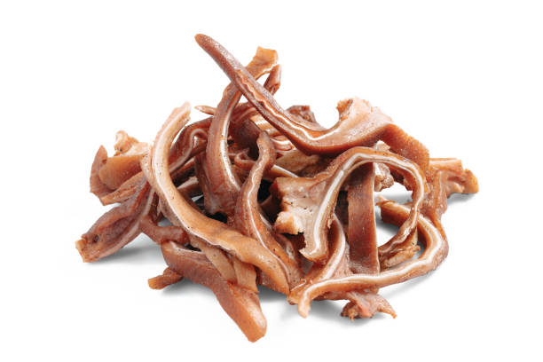 istock Traditional gourmet marinated sliced pig ears on white background. 1395200309