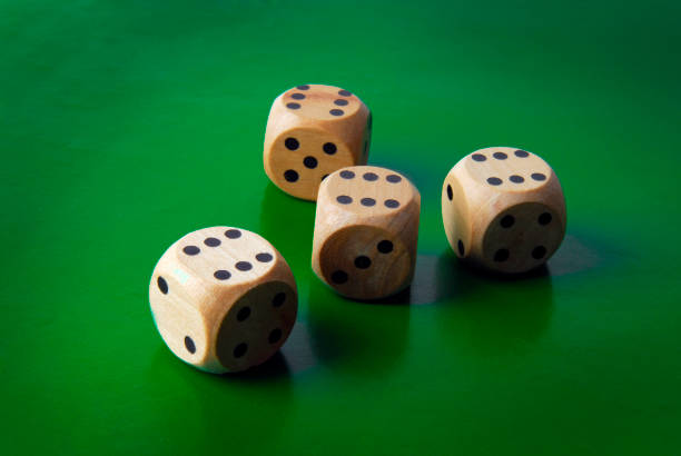 close up of dices on green background