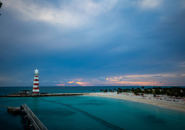 istock A sunset over idilic travel destination with a beach next to lighthouse 1395204390