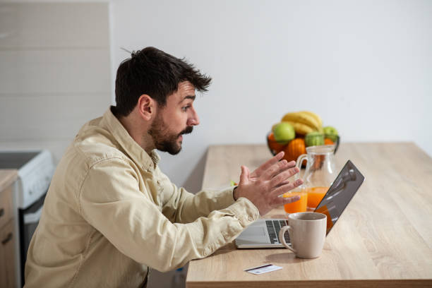 istock Handsome young man at his home, on a video call 1395204546