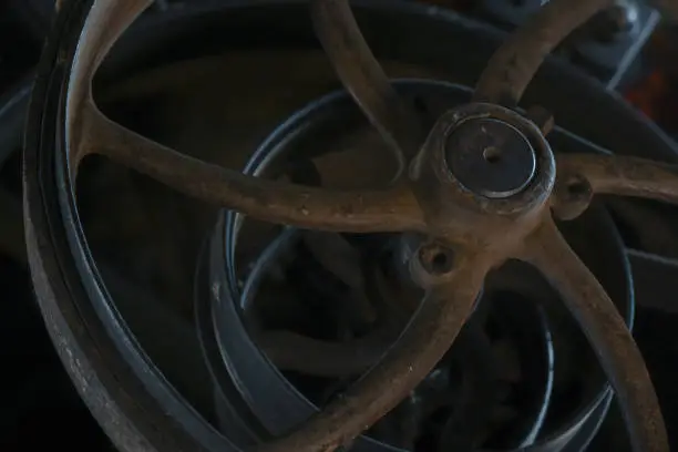 Flywheels in an abandoned wool mill.