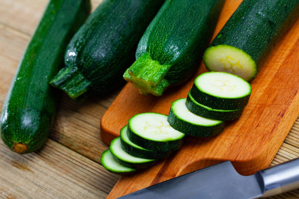 istock Whole and sliced fresh zucchinis 1395204748