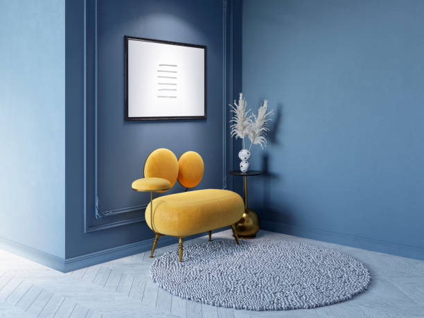 istock A modern classic interior with an illuminated horizontal poster on a dark blue wall with moldings, dried flowers in a vase on a coffee table near the original orange armchair. 1395205728