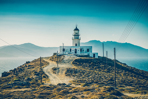 Armenistis Lighthouse at NW part of Mykonos island, Cyclades, Greece in afternoon.