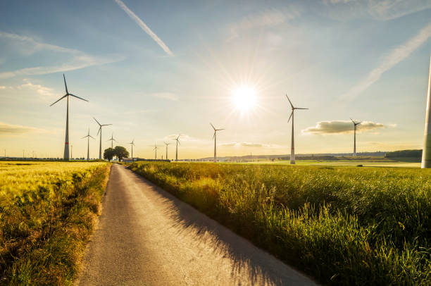 Windturbines at sunset Windturbines at sunset in an agricultural area in the middle of Germany, North Rhine-Westphalia near Bad Wuennenberg wind turbine photos stock pictures, royalty-free photos & images