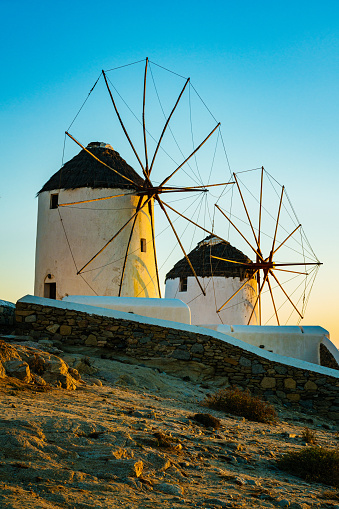 Windmills in Mykonos town (Chora), Mykonos island, Cyclades, Greece at sunset.