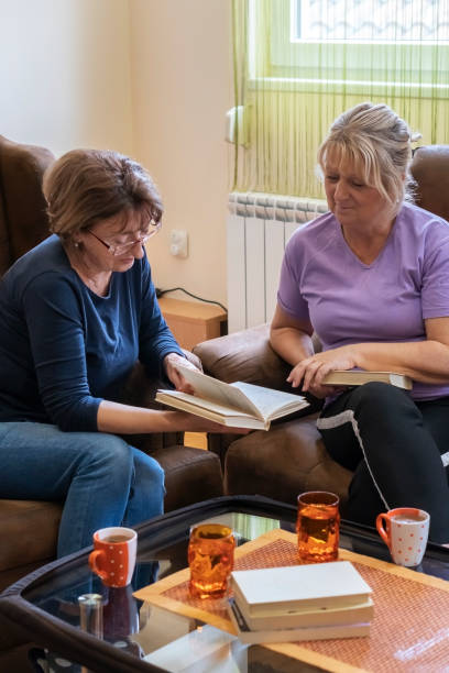 istock Retired women enjoying book club 1395210192