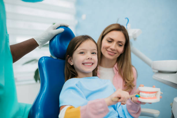 istock Little girl visiting a dentist 1395211392