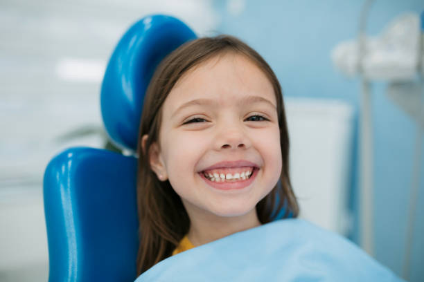 Little girl visiting a dentist stock photo