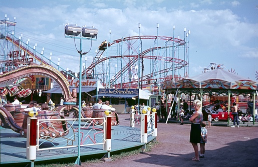 Zehlendorf, Berlin (West), Germany, 1970. At the German-American folk festival. Also: roller coaster, carousels and visitors.