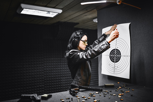 Female Shooter Spreading Out Her Target To See Results