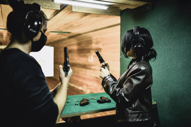 istock First Firearm Safety Lessons For Female By Male Guns Instructor On Range 1395214063