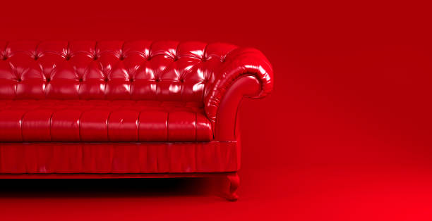 istock Red quilted leather sofa on red background front view. Creative concept of minimalistic interior, stylish vintage chester sofa. Single piece of furniture. Bright luxury red couch 1395214685