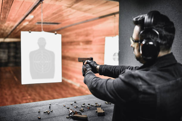 istock Rear View Of Male Shooting At Target Close Range 1395214720