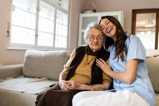 istock Happy young nurse with her senior patient 1395214944