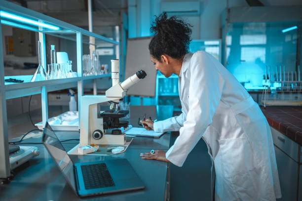 istock Woman of Science Working in the Laboratory 1395215288