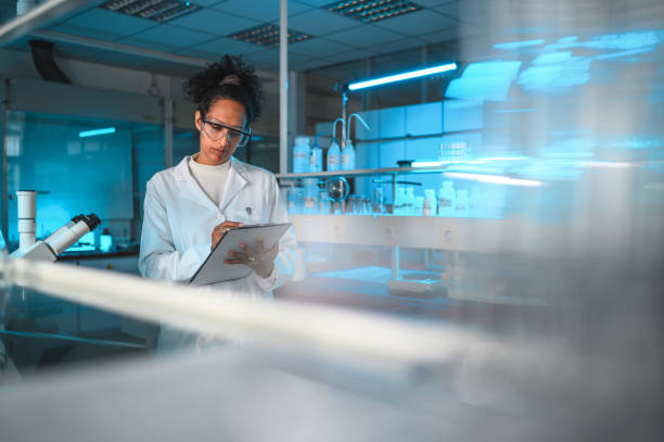 istock Young Female Scientist Checking the Results 1395215301