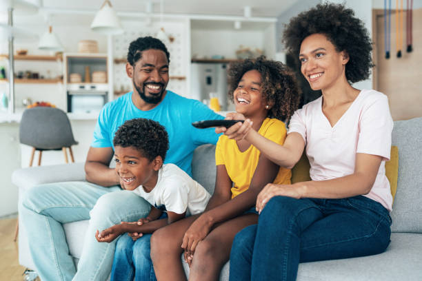 istock Family watching television 1395217446
