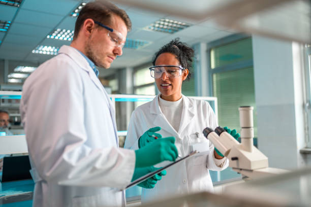 istock Mixed Mid Adult Science Team in Lab Wear 1395217583