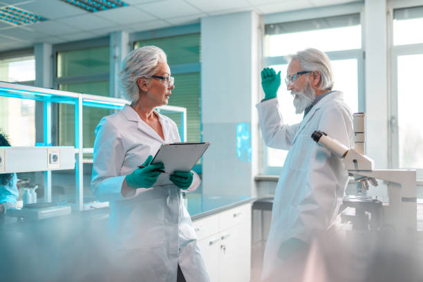 istock Mature Laboratory Researchers Making a Discovery 1395217591