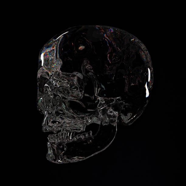 istock A delicate crystal skull on dark background. 1395217758