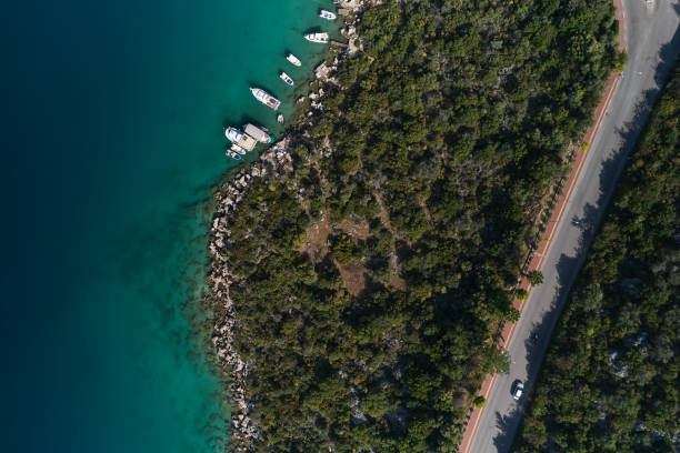 istock Yacht on the water surface from top view. Turquoise water background from top view. Summer seascape from air. Travel concept and idea 1395220172