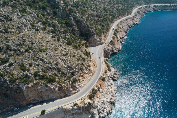 istock Seaside road approaching a beach, seen from above 1395220406