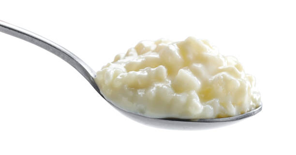 istock spoon of rice and milk pudding 1395223969